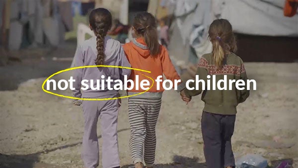 Three little girls walk away from the camera holding hands, while the words not suitable for children are superimposed on the image.